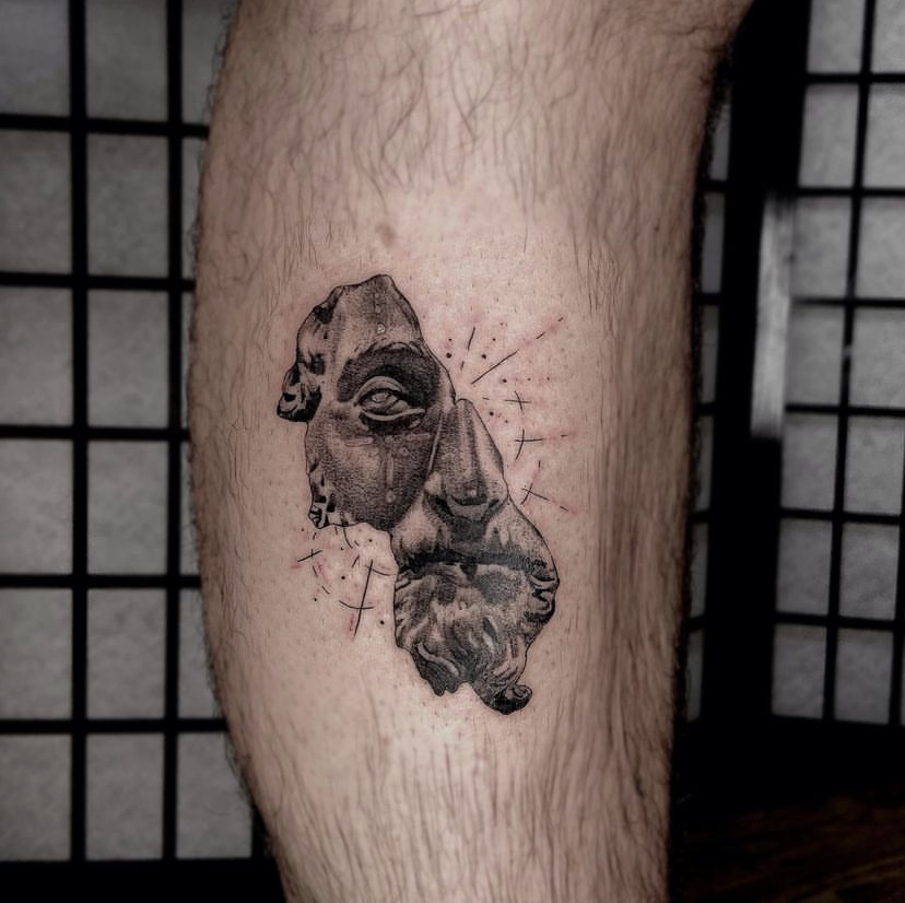 half-statue tattoo/micro-realism